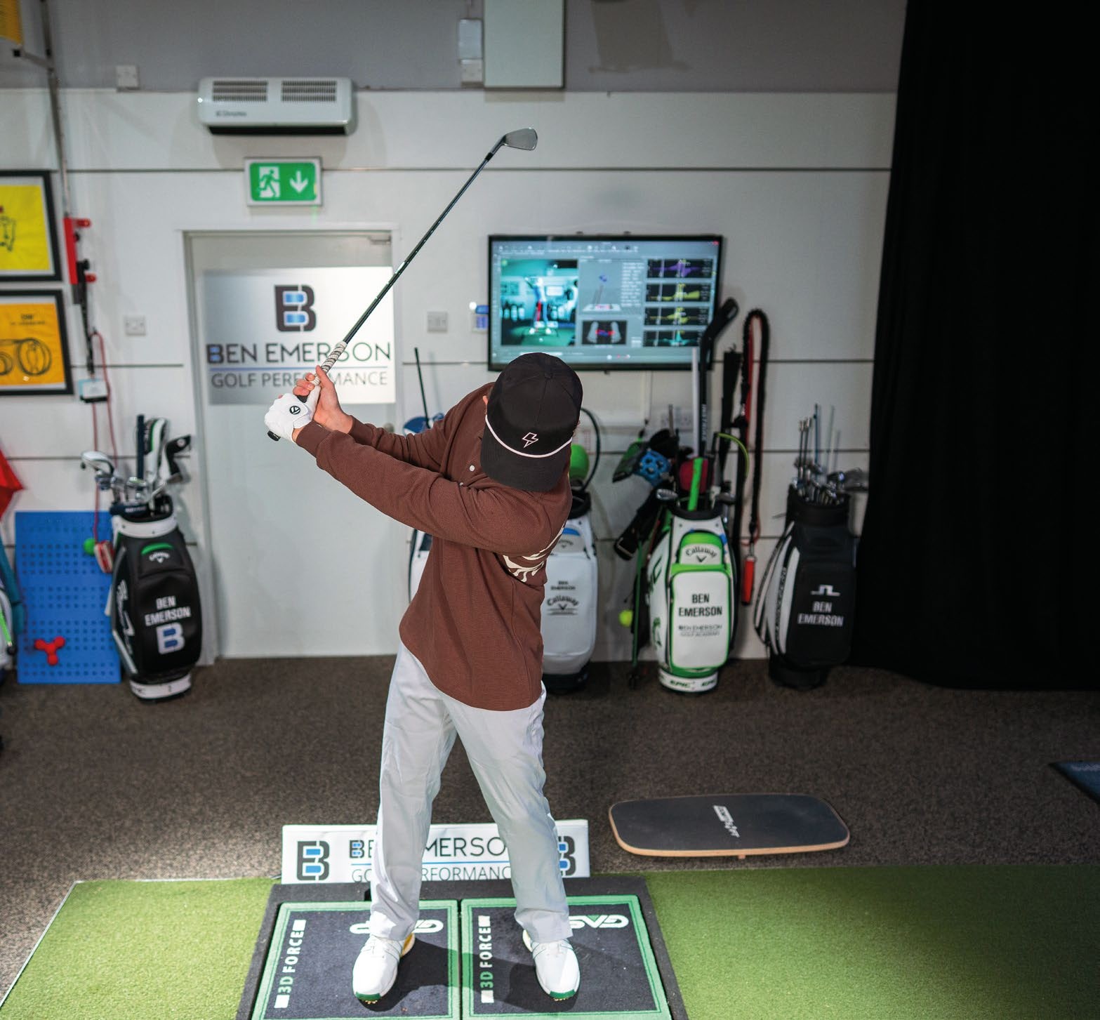 Amateur golfer, Benjamin, demonstrating reverse spine angle in his golf swing during a clinic with Ben Emerson