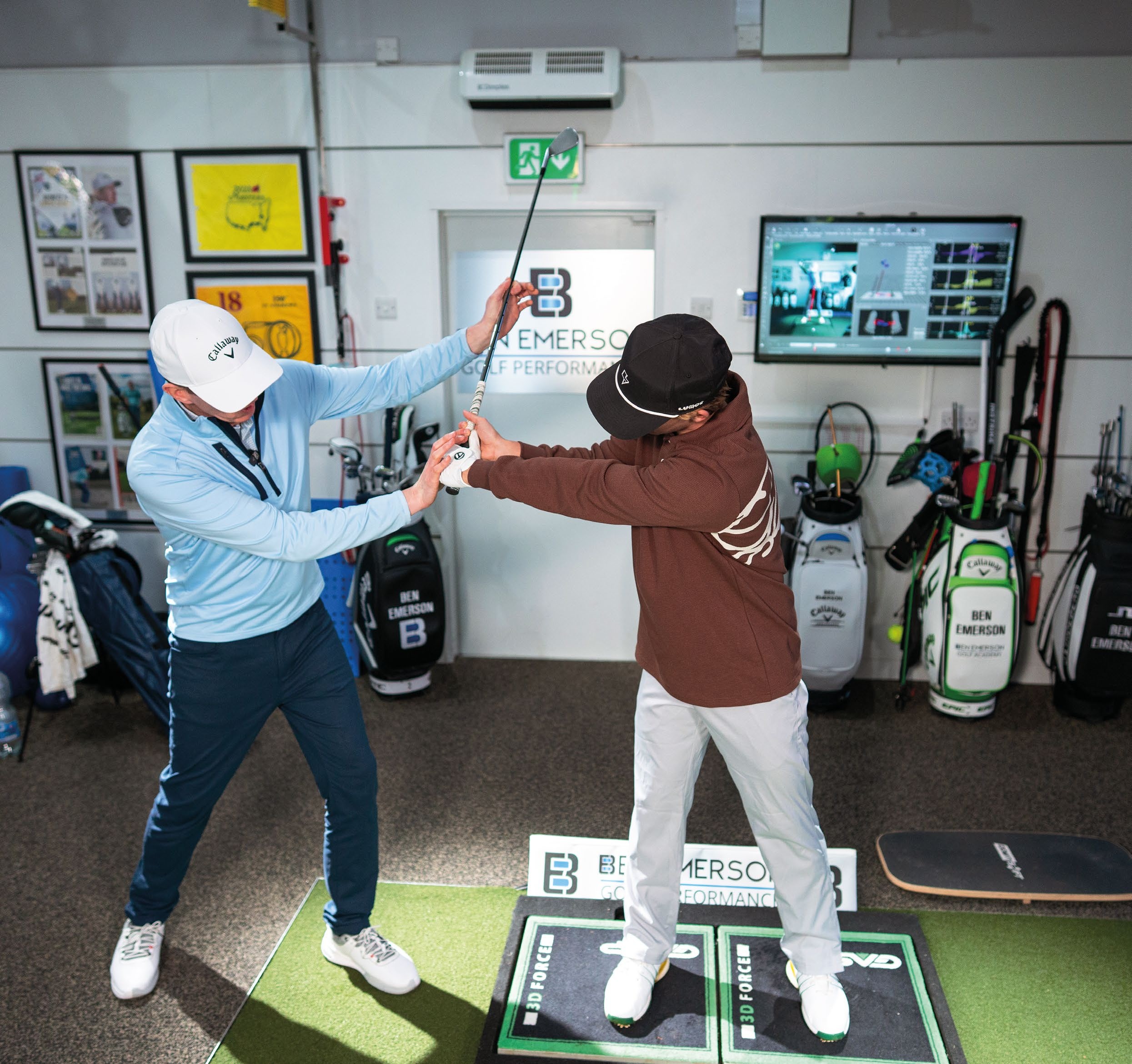 Ben Emerson helping Benjamin into a better position at the top of the backswing