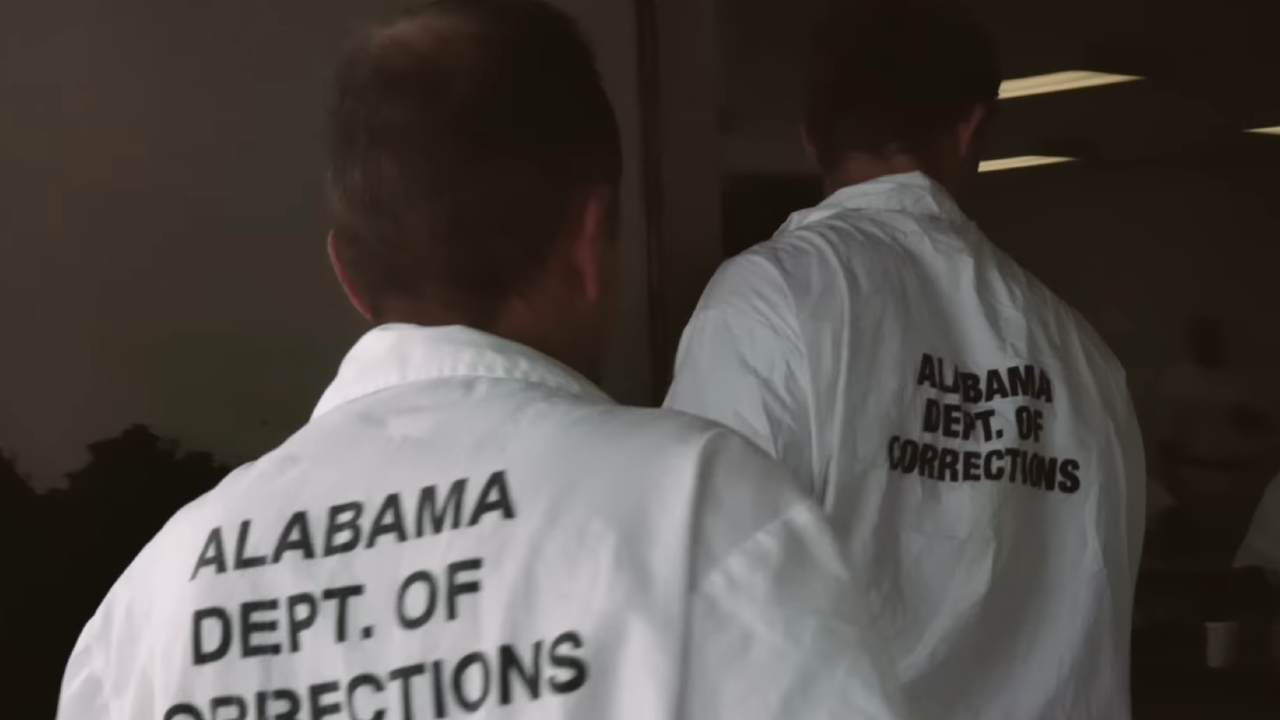 Inmates walking in The Alabama Solution