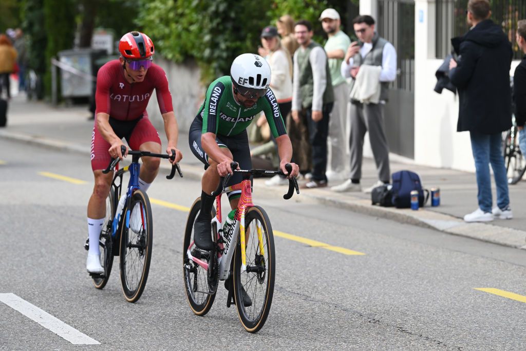 ZURICH SWITZERLAND SEPTEMBER 29 LR Toms Skujins of Team Latvia and Ben Healy of Team Ireland compete in the chase group during the 97th UCI Cycling World Championships Zurich 2024 Mens Elite Road Race a 2739km one day race from Winterthur to Zurich on September 29 2024 in Zurich Switzerland Photo by Dario BelingheriGetty Images