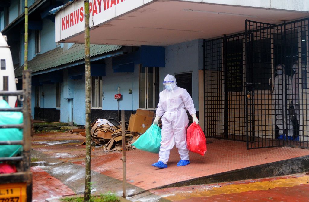 A health official stands outside the Kozhikode Medical College Hospital ward, which has been converted into a Nipah virus isolation ward on September 06, 2021 in Kozhikode, India.