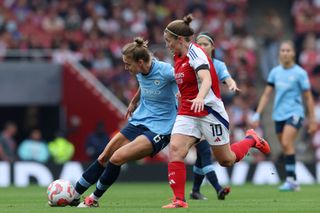 Vivianne Miedema of Manchester City is challenged by Kim Little of Arsenal during the Barclays Women&#039;s Super League match between Arsenal and Manchester City at Emirates Stadium on September 22, 2024 in London, England.