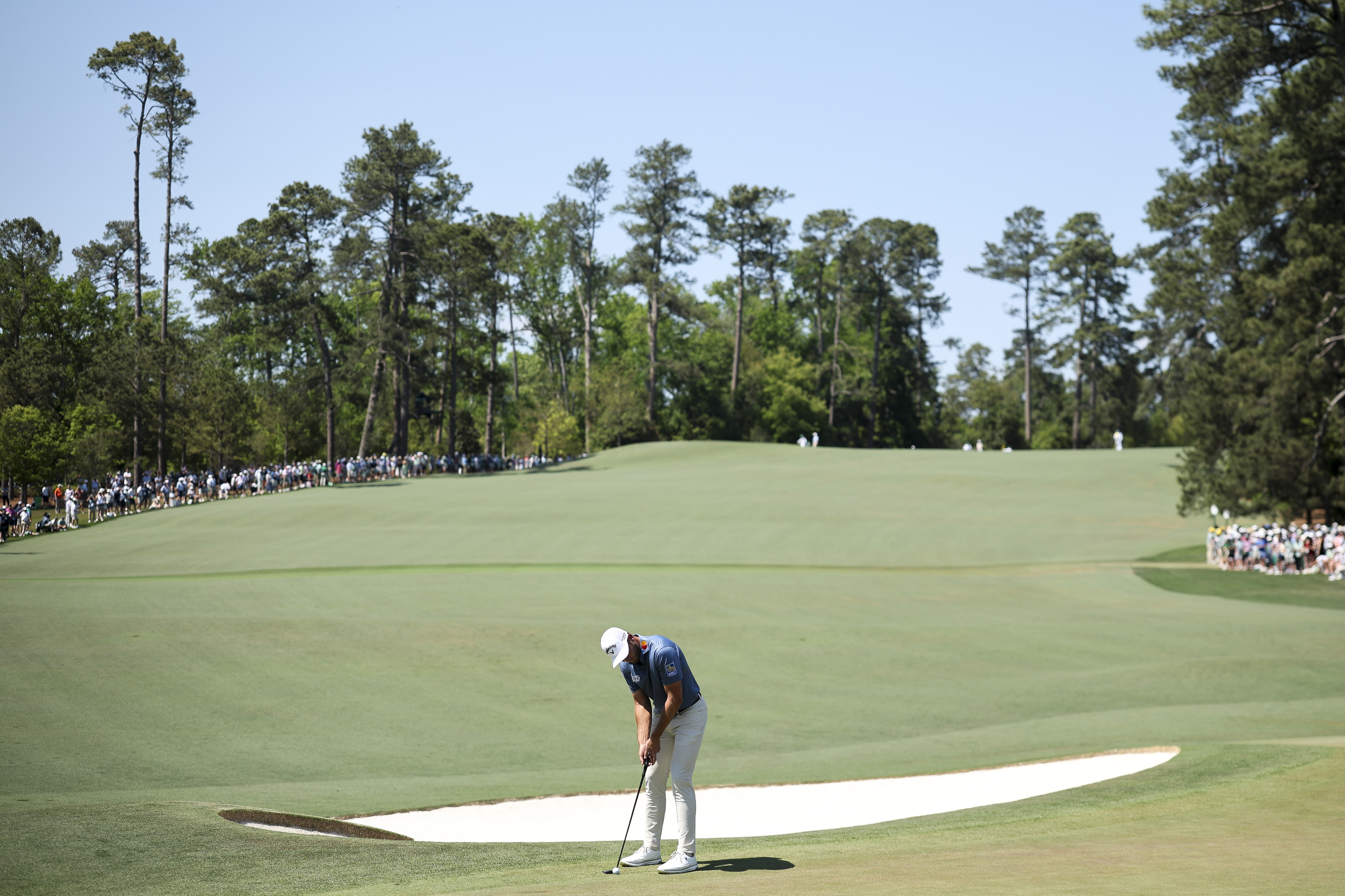 Sam Burns putts on the second green during the final round of the 2026 Masters Tournament at Augusta National Golf Club