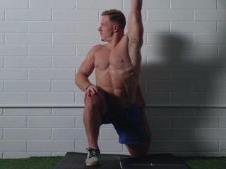 Man performing a couch stretch