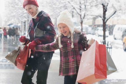  grandmother and granddaughter shopping for Christmas gifts 