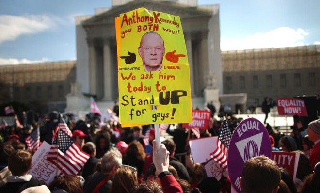 A sign depicting Justice Anthony Kennedy is housed outside the Supreme Court on March 27.