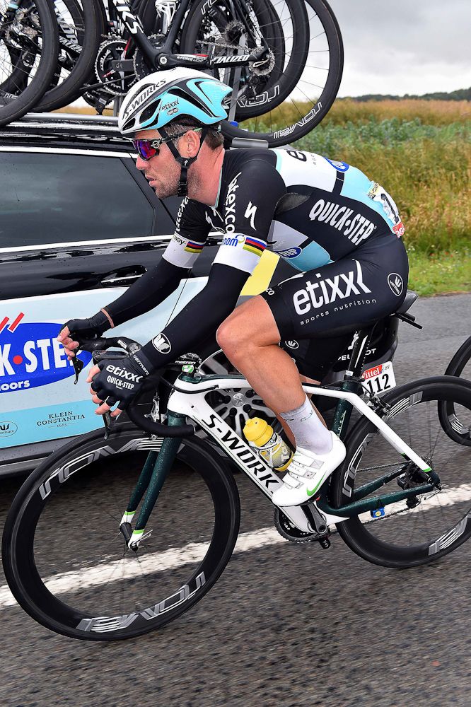 Mark Cavendish rides alongside the team car during stage 5.