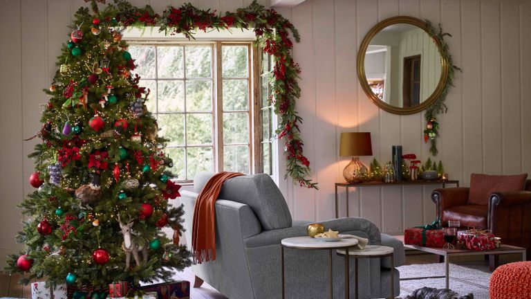 Traditional Christmas decor in a living room red and green decor by John Lewis & Partners