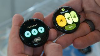 Pixel Watch 4 (right) next to the original Pixel Watch (left) showing the Fitbit Quick Start tile