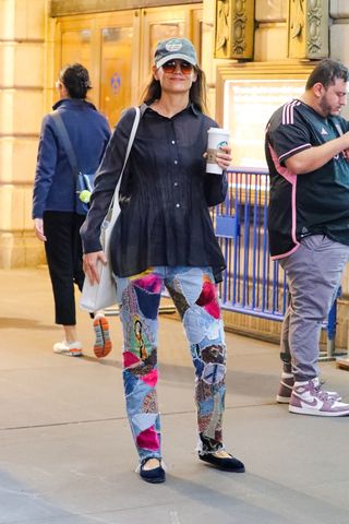 Katie Holmes wears patchwork jeans and her favorite blouse for a Starbucks run in NYC.