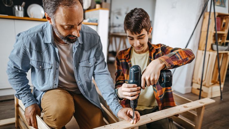 best cordless drill: father and son using cordless drill