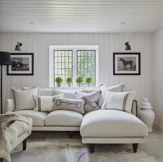 snug with white wood panelling in elegant surrey house