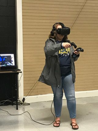 Student wearing AR/VR helmet