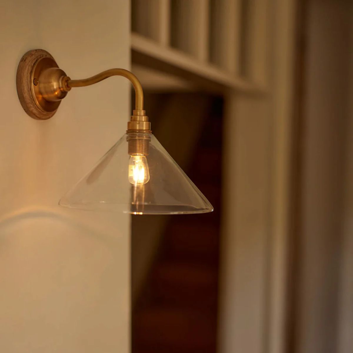 Glass and brass wall light