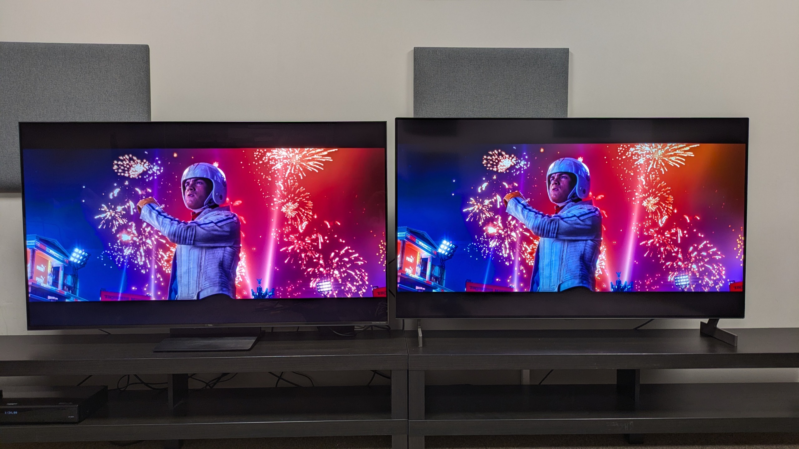 TCL C7L (left) vs LG B6E (right) with shot of Speed Racer stood in front of fireworks from Speed Racer