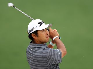Hideki Matsuyama hitting a wedge shot at Augusta National