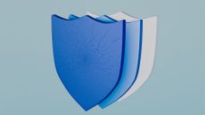 Cyber resilience concept image showing three shields in a layered formation with front-facing shield slightly cracked.