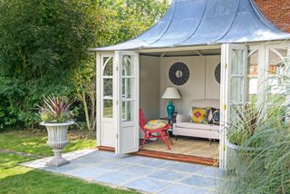 Traditional summerhouse used as outdoor living room