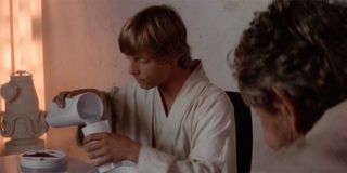 Luke pouring himself a glass of blue milk in Star Wars: A New Hope