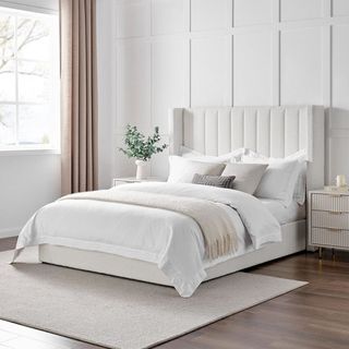 White boucle bed frame in white bedroom