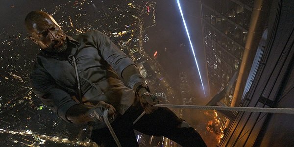 Skyscraper Dwayne Johnson rapelling from a flaming building