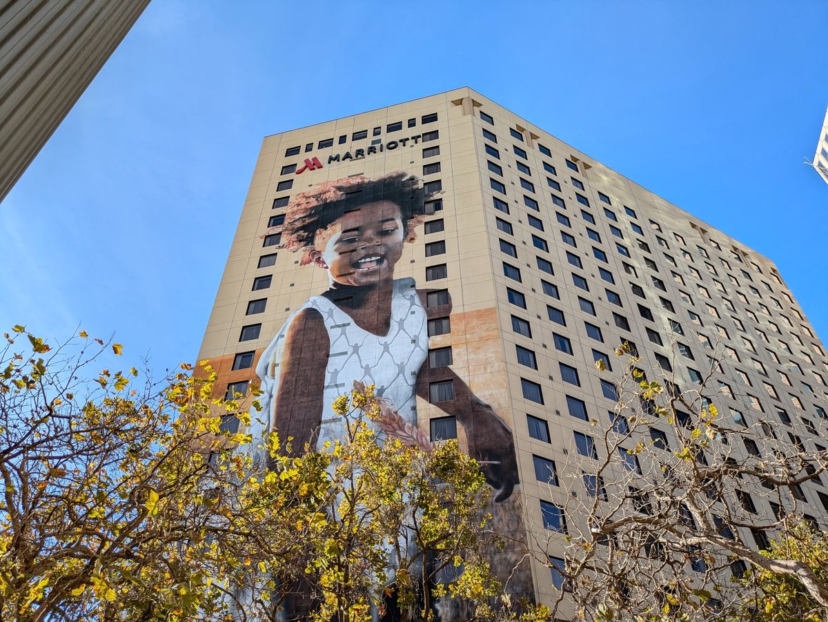 mural of a girl on a high-rise building in Oakland shot by a Pixel 8a