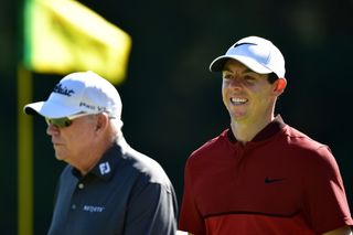 Butch Harmon and Rory McIlroy walk down the fairway