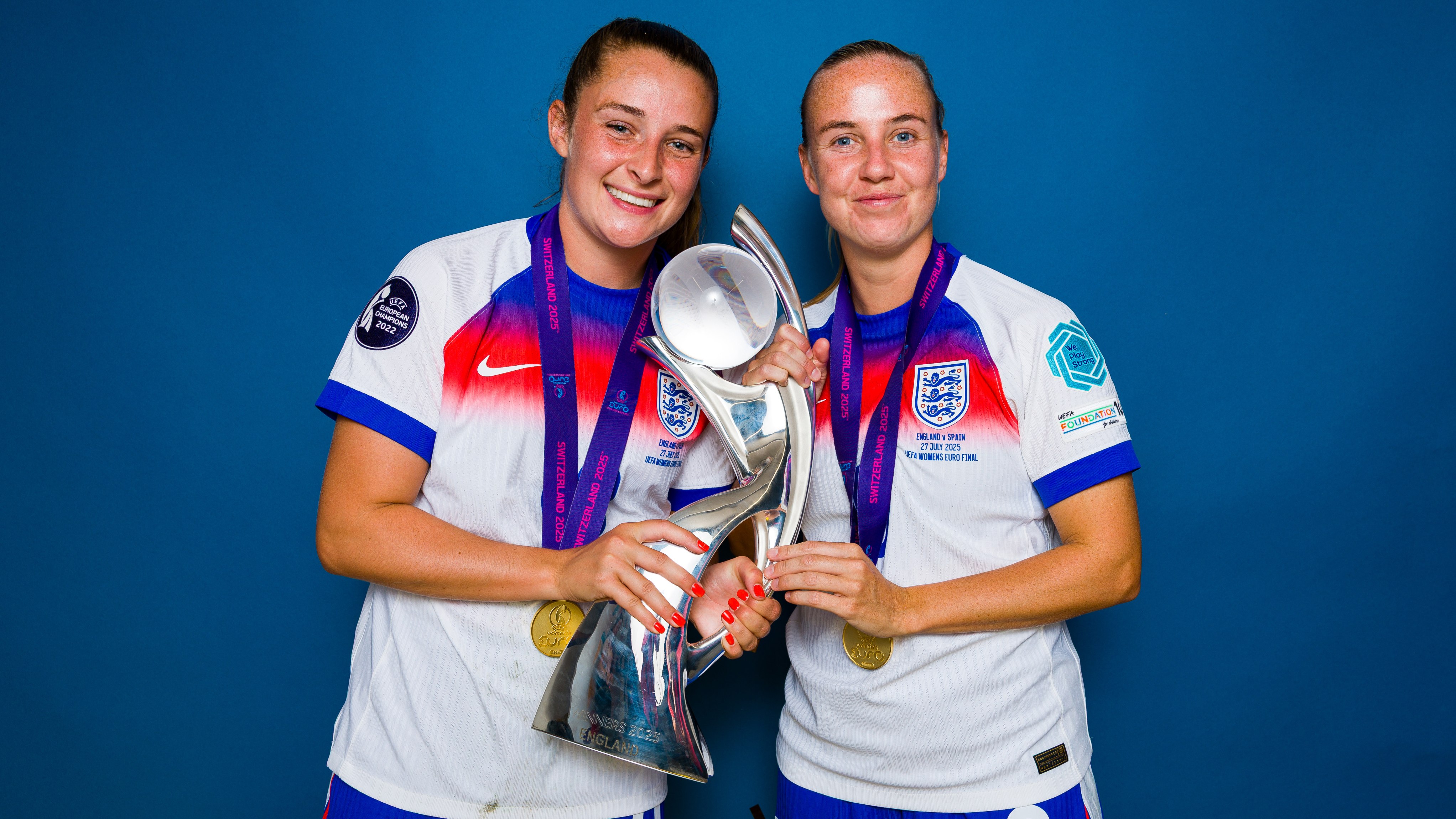 Ella Toone and Beth Mead of England poses for a portrait with the UEFA Women's EURO trophy