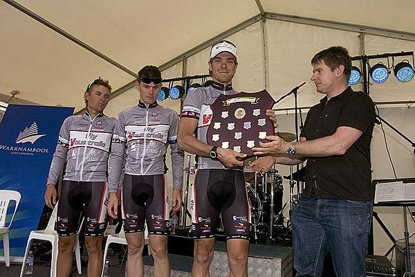 Two-time Melbourne to Warrnambool winner Jamie Drew (right) presents David Kemp, Hayden Brooks and Scott Davis of Fly V Australia with the National Road Series trophy for best team overall.