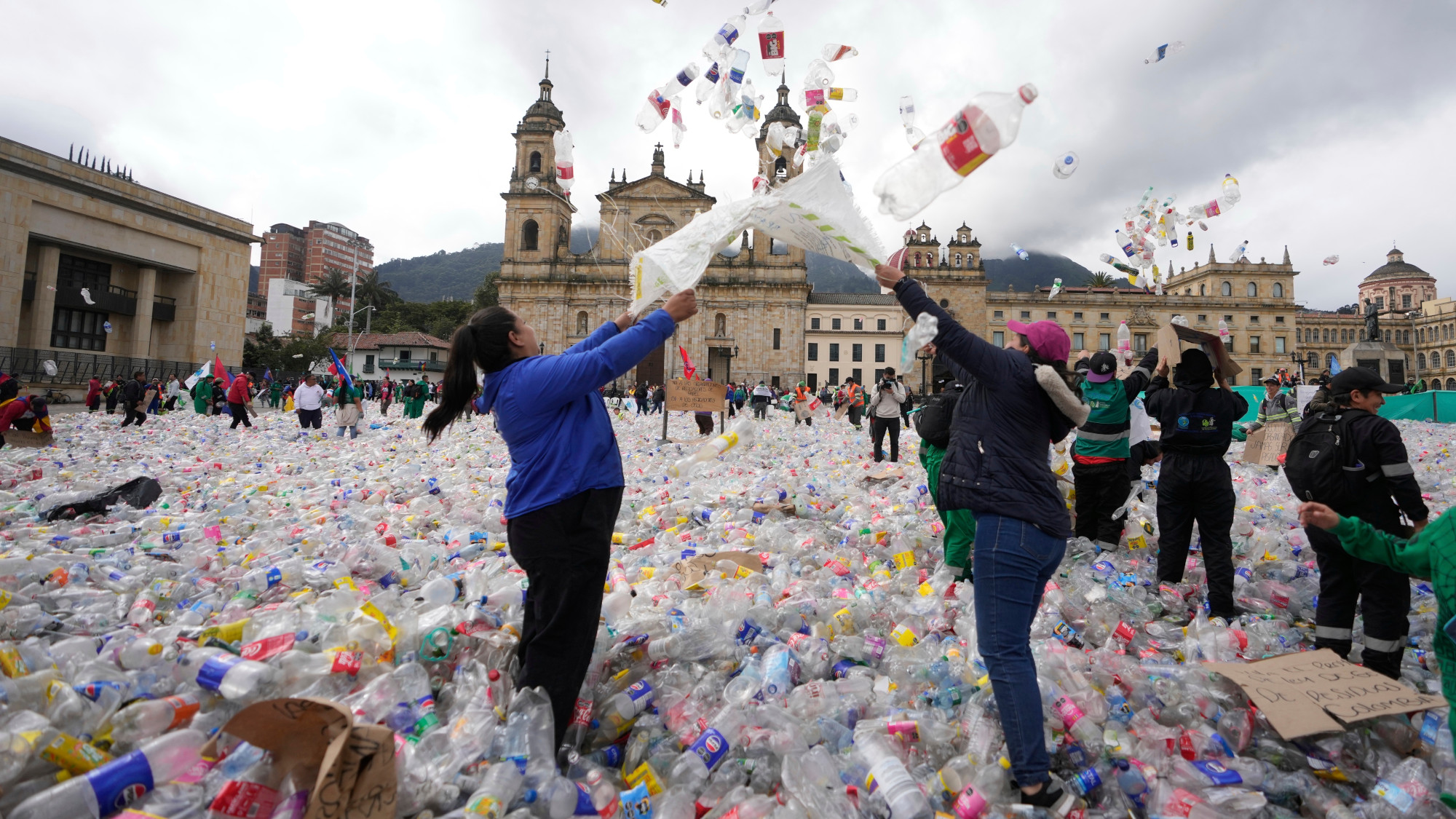 People throwing plastic bottles
