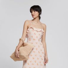 woman wearing floral midi dress