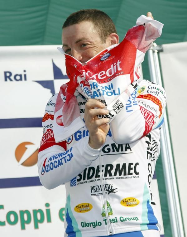 Sella pulls on the overall winner's red jersey