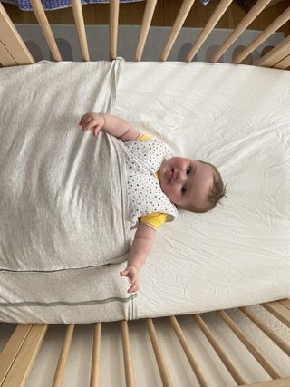 Baby Freddie in the ergoPouch Baby Tuck Sheet