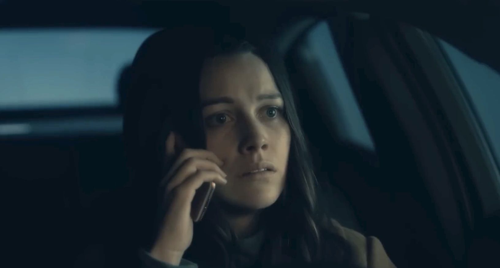 Nell on the phone in the car while seeing the Bent-Neck lady.