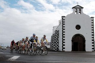 The Columbia-HTC squad pass a church on the Island of Lanzarote.