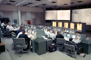 Mission Control in Houston as seen staffed for the Gemini 4 mission when it became active for the first time in NASA's histo