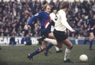 Tottenham's Phil Beal is challenged by Manchester City's Francis Lee during a game in February 1973.