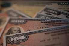 U.S. savings bonds are seen in this arranged photograph taken with a tilt-shift lens to illustrate the theme of risk