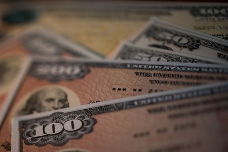 U.S. savings bonds are seen in this arranged photograph taken with a tilt-shift lens to illustrate the theme of risk