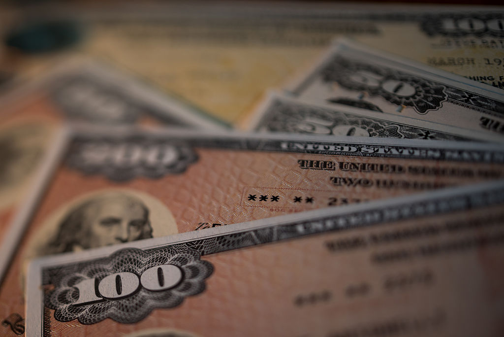 U.S. savings bonds are seen in this arranged photograph taken with a tilt-shift lens to illustrate the theme of risk
