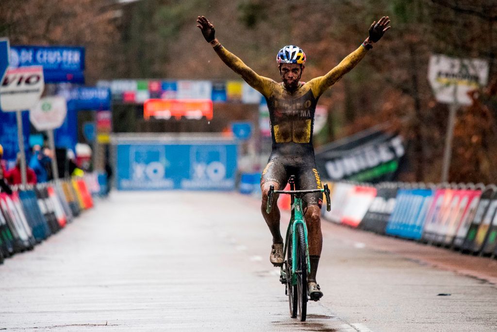 Belgian Wout Van Aert celebrates as he crosses the finish line to win the mens elite race of the Herentals Crosst cyclocross cycling race the fourth stage out of 8 of the X2O Badkamers Trofee Veldrijden Trophy in Herentals on December 23 2020 Photo by JASPER JACOBS Belga AFP Belgium OUT Photo by JASPER JACOBSBelgaAFP via Getty Images