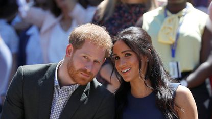 SYDNEY, AUSTRALIA - OCTOBER 19: Prince Harry, Duke of Sussex and Meghan, Duchess of Sussex watch a performance during their visit to Macarthur Girls High School on October 19, 2018 in Sydney, Australia. The Duke and Duchess of Sussex are on their official 16-day Autumn tour visiting cities in Australia, Fiji, Tonga and New Zealand. (Photo by Phil Noble - Pool/Getty Images)