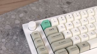 A shell white Keychron Q65 Max wireless mechanical keyboard