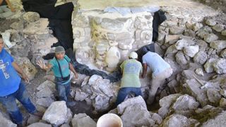 The stucco mask of Ucanha being worked on by archaeologists