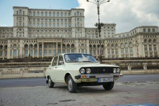 Car in front of Bucharest's Palace of the Parliament