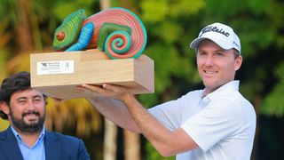 Russell Henley with the trophy after the 2022 World Wide Technology Championship at Mayakoba