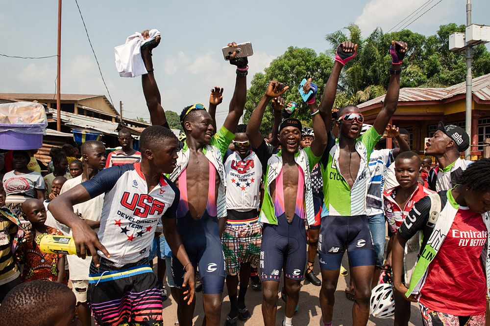 Lunsar squad captain, Mohammed Ben Conteh (in cap) leads the celebrations. Several riders wore Rapha EF Education kit donated by Lachlan Morton