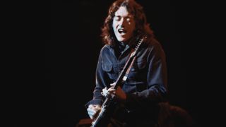 Rory Gallagher performs on stage at Reading Festival, United Kingdom, 16th March 1975