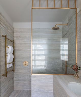 bathroom shower with beige tiles