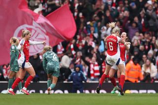 Emily Fox of Arsenal celebrates scoring her team's fifth goal with teammate Leah Williamson during the Barclays Women's Super League match between Arsenal FC and Tottenham Hotspur FC at Emirates Stadium on February 16, 2025 in London, England.